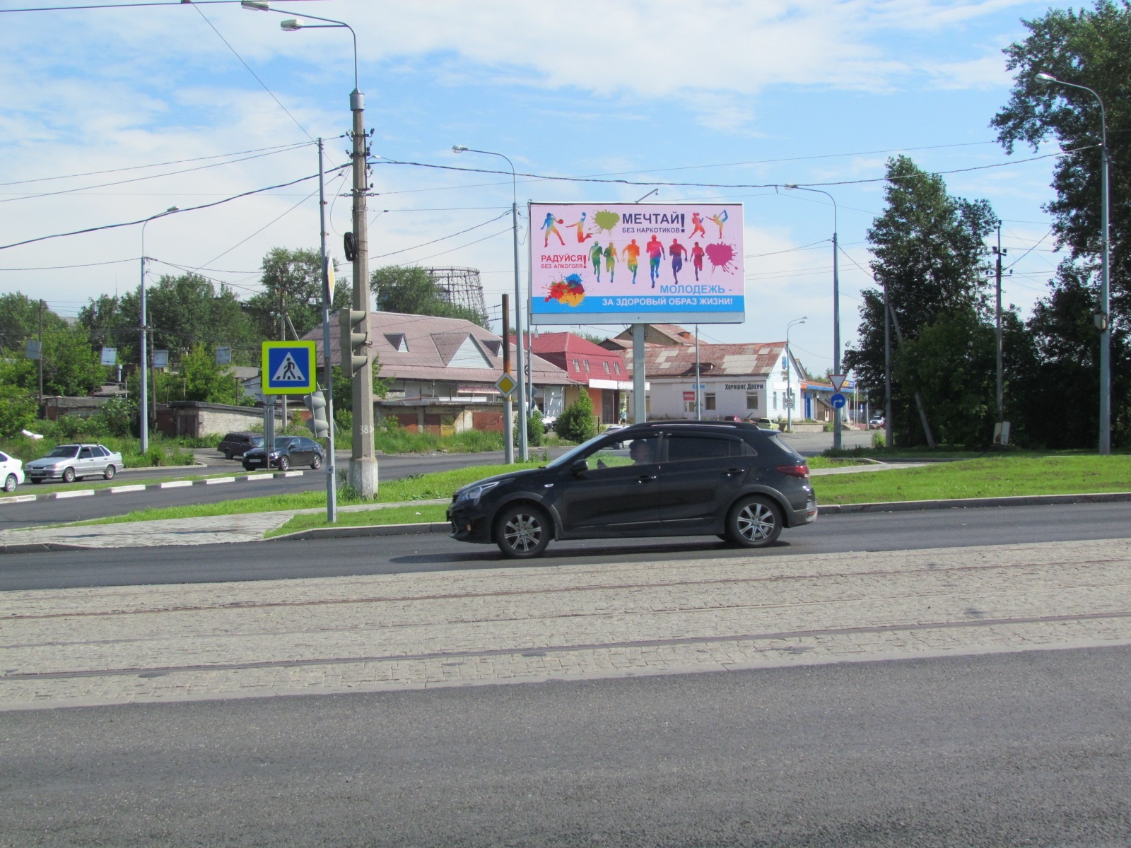 Реклама 3x6 по адресу Индустриальная ул., р-н мелькомбината, в развязке, из города (Digital)